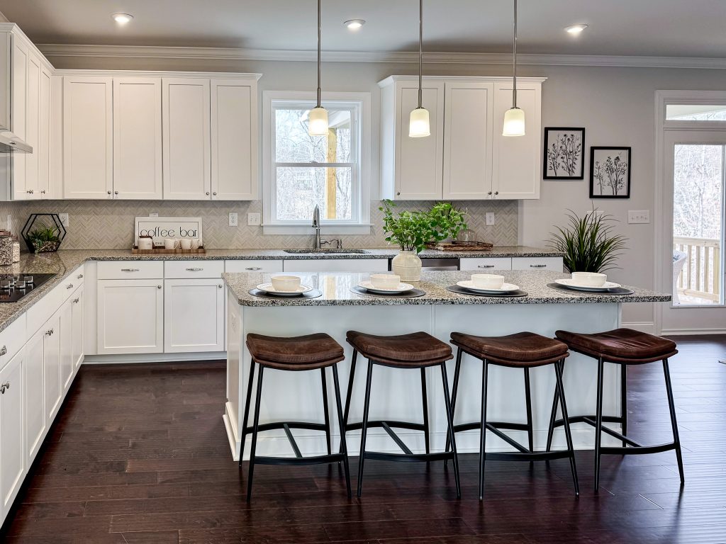 Kitchen with island and white cabinets