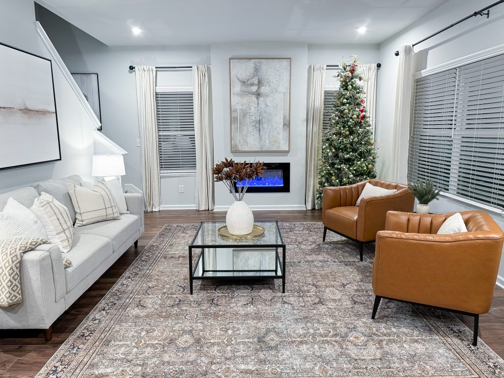 Living room with electric linear fireplace and Christmas tree