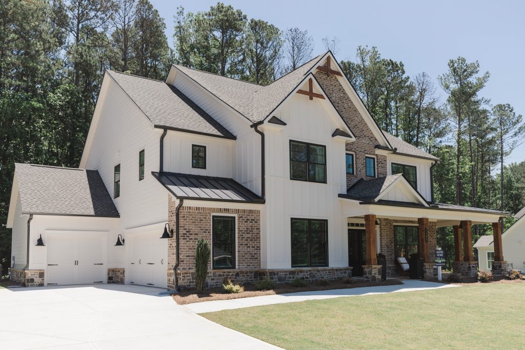 Angled image of Two Story White house With brick accents - KFH - Ford Landing