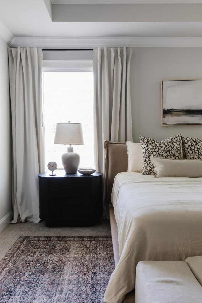 Side view of bed with beside table