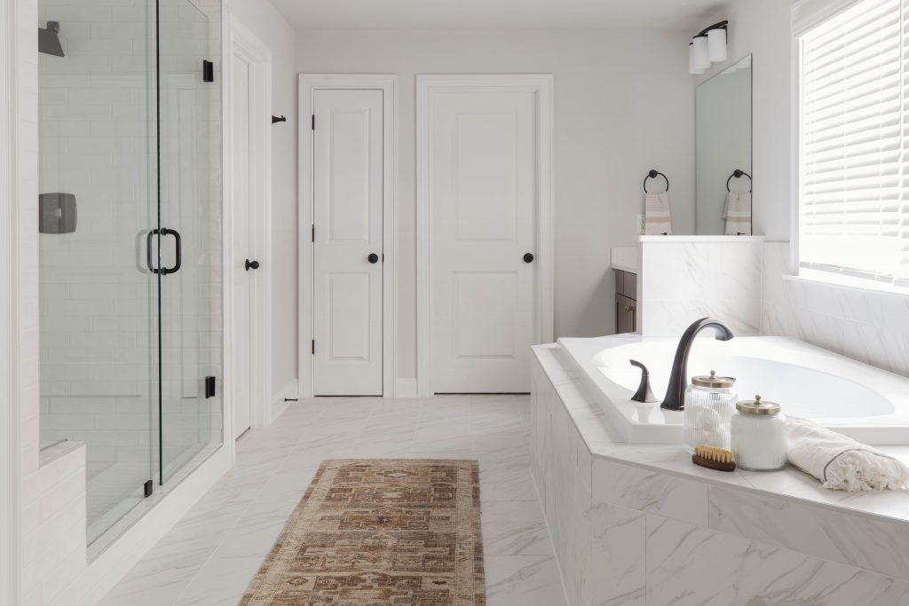 Primary bathroom with separate soaking tub and standing shower