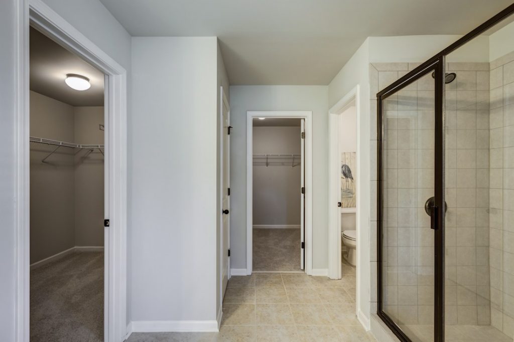 Master bath with his and hers closets at Cowan Ridge