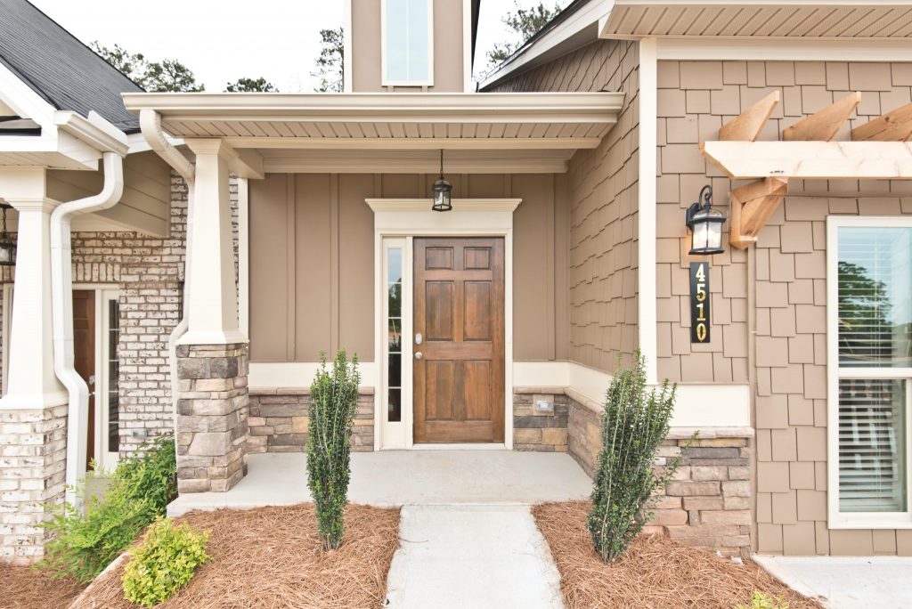 A compact porch front entry style in Villas at Hickory Grove