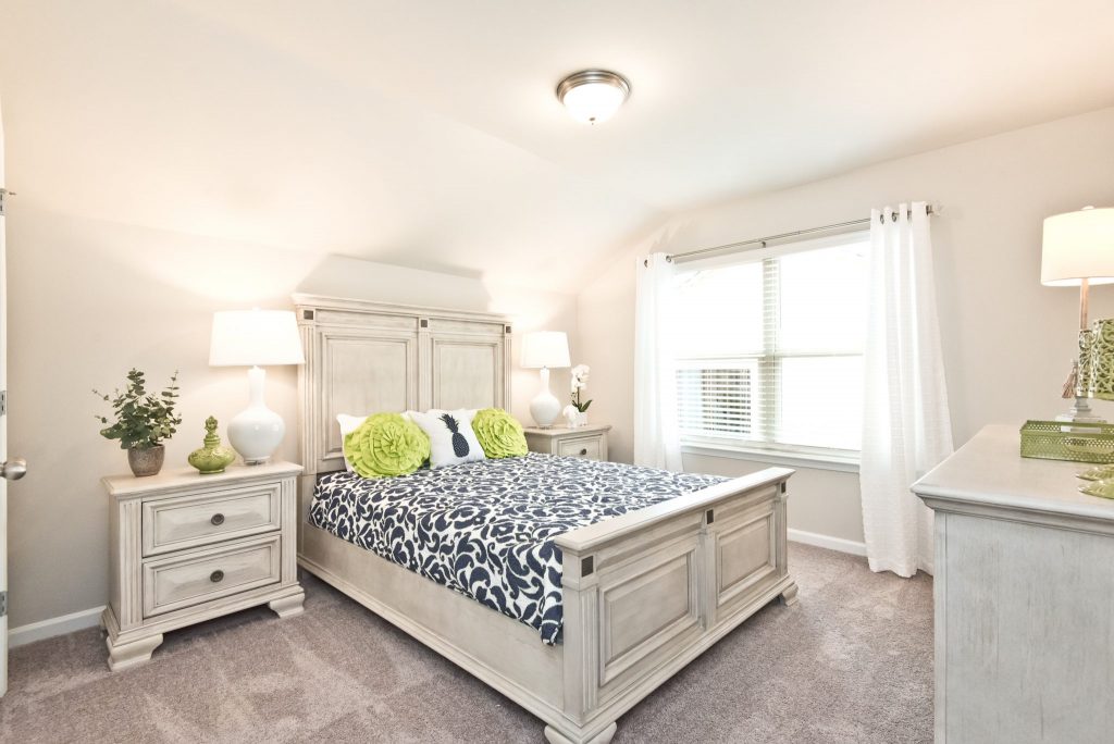 A single bedroom guest room in Villas at Hickory Grove