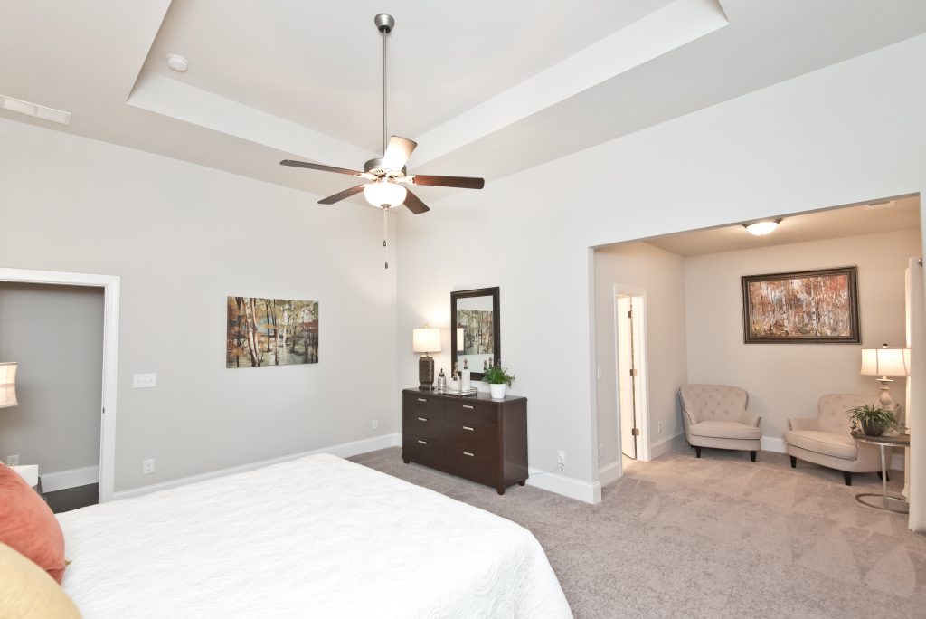 A master suite with sitting area