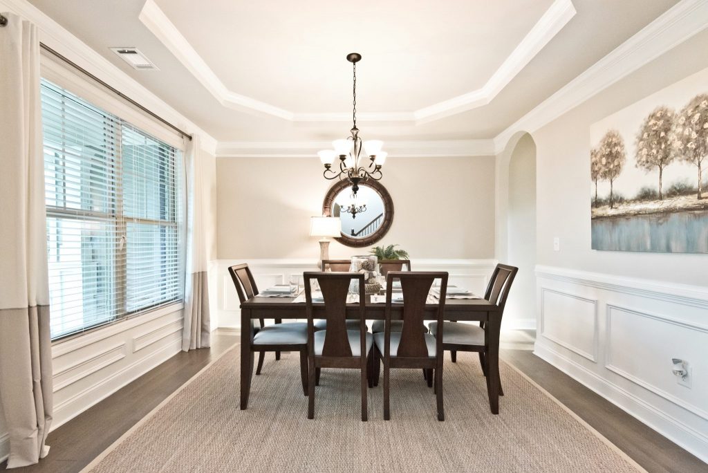 A dining room on the main level of a River Rock home