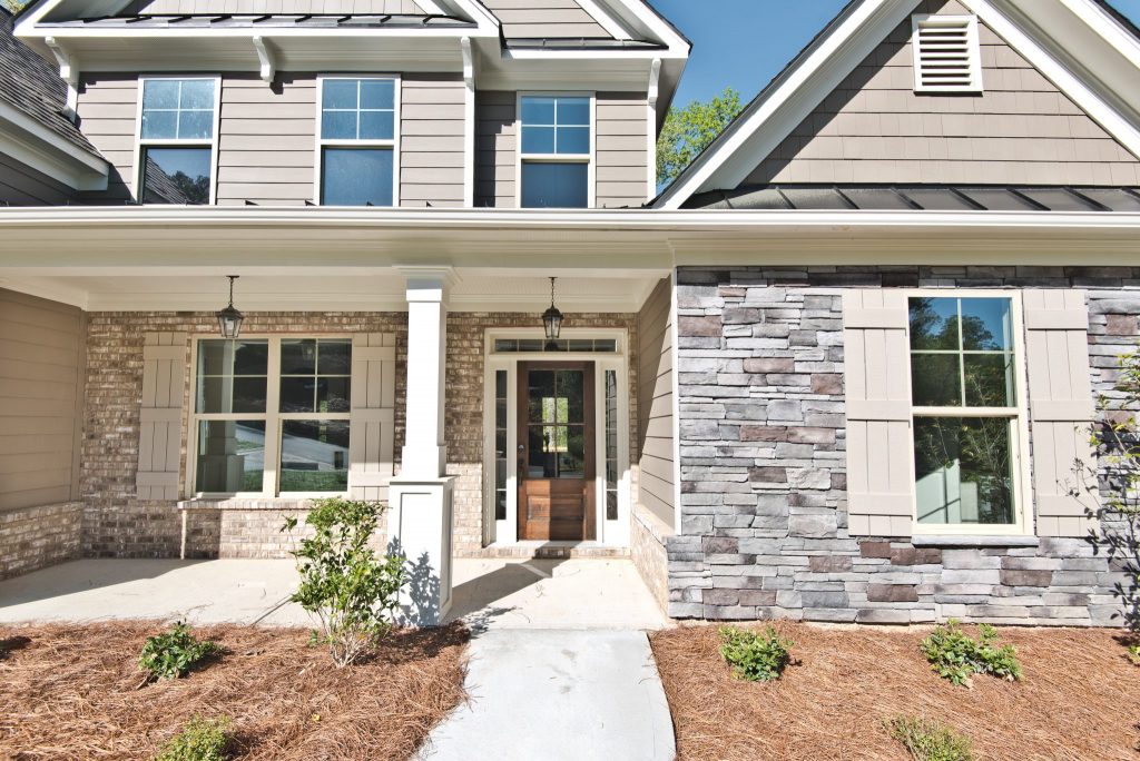 The front porch of a River Rock home, ready for decorating