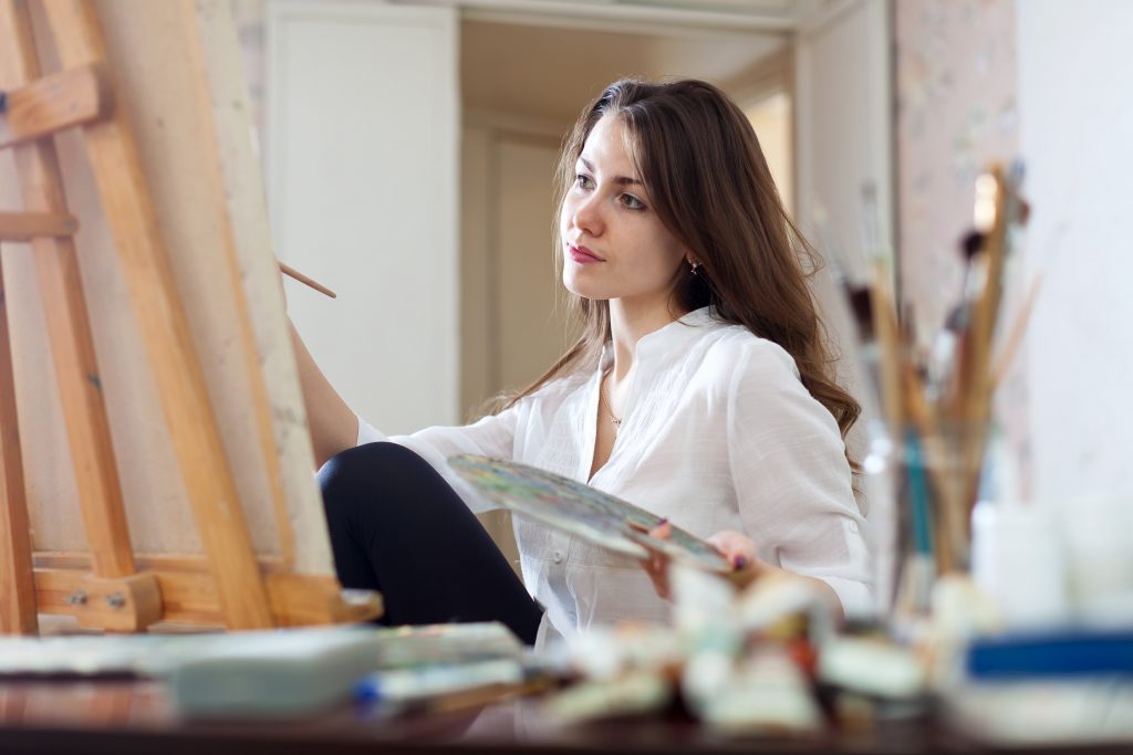 Beautiful Woman Painting In Extra Bedroom " jackf© 123rf"