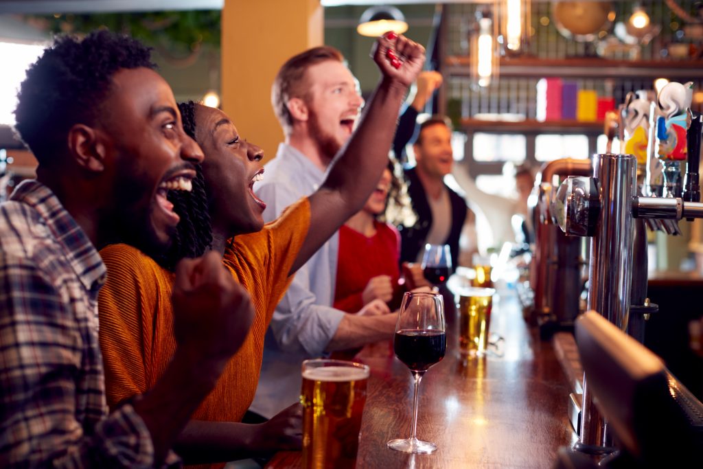 Metro Atlanta people watching the game in a restaurant in the Battery Monkey Business Images© Shutterstock
