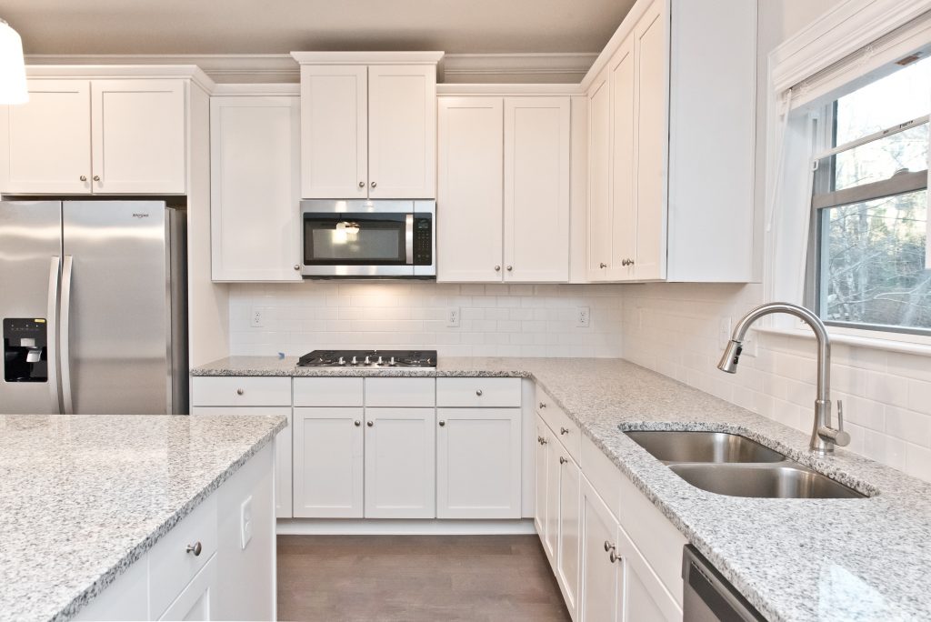 White kitchen with stainless steel appliances new homes for sale South Fulton 