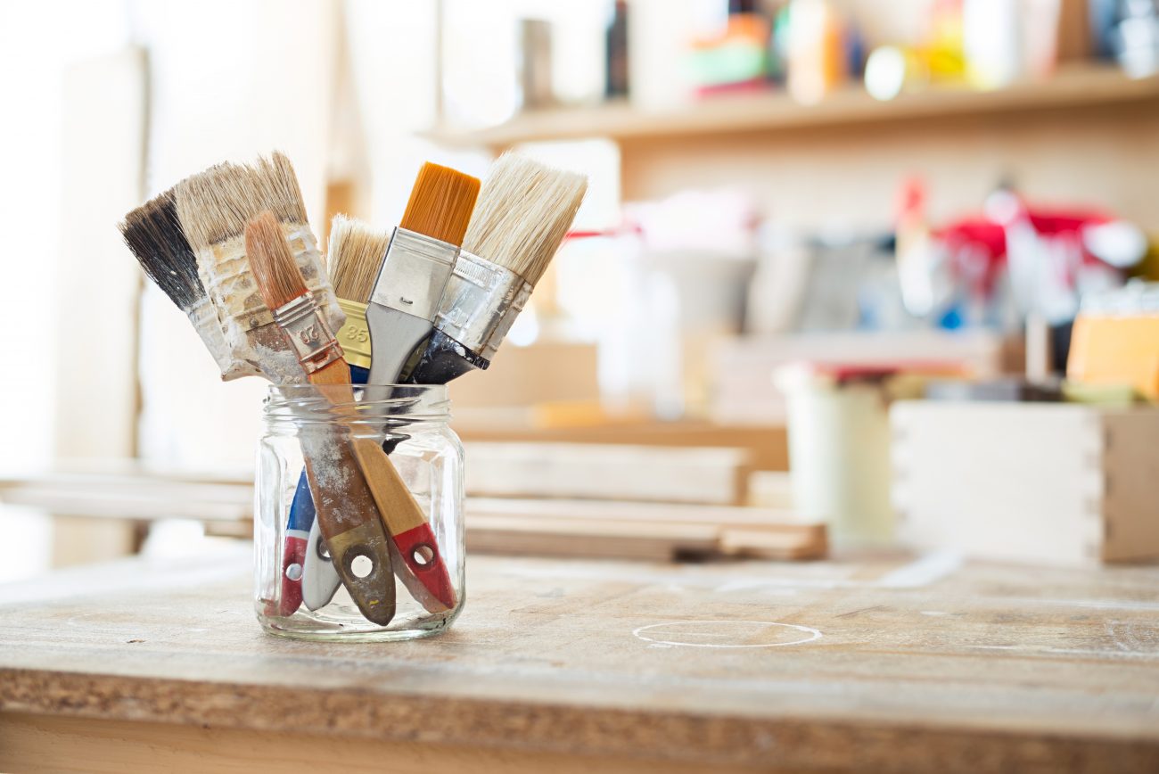 Paint brushes on work bench in garage ©donatas1205