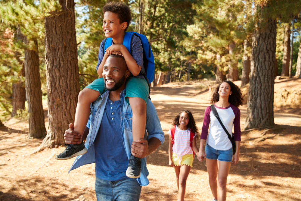 Family walking park trail in Austell ©Monkey Business Images