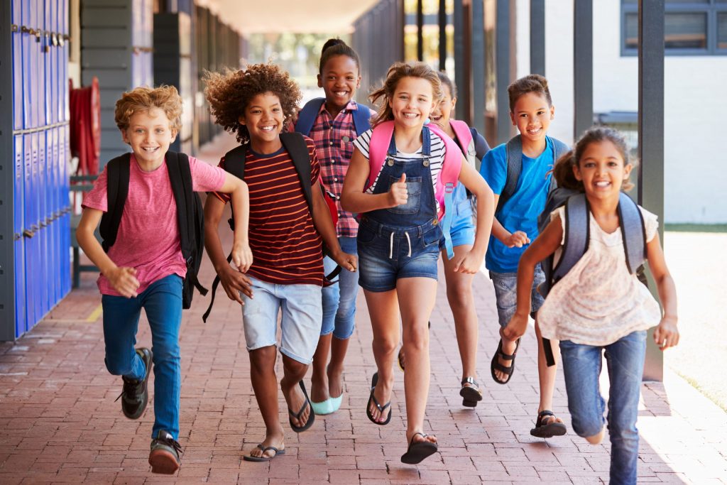 Kids running and having fun at school ©Monkey Business Images