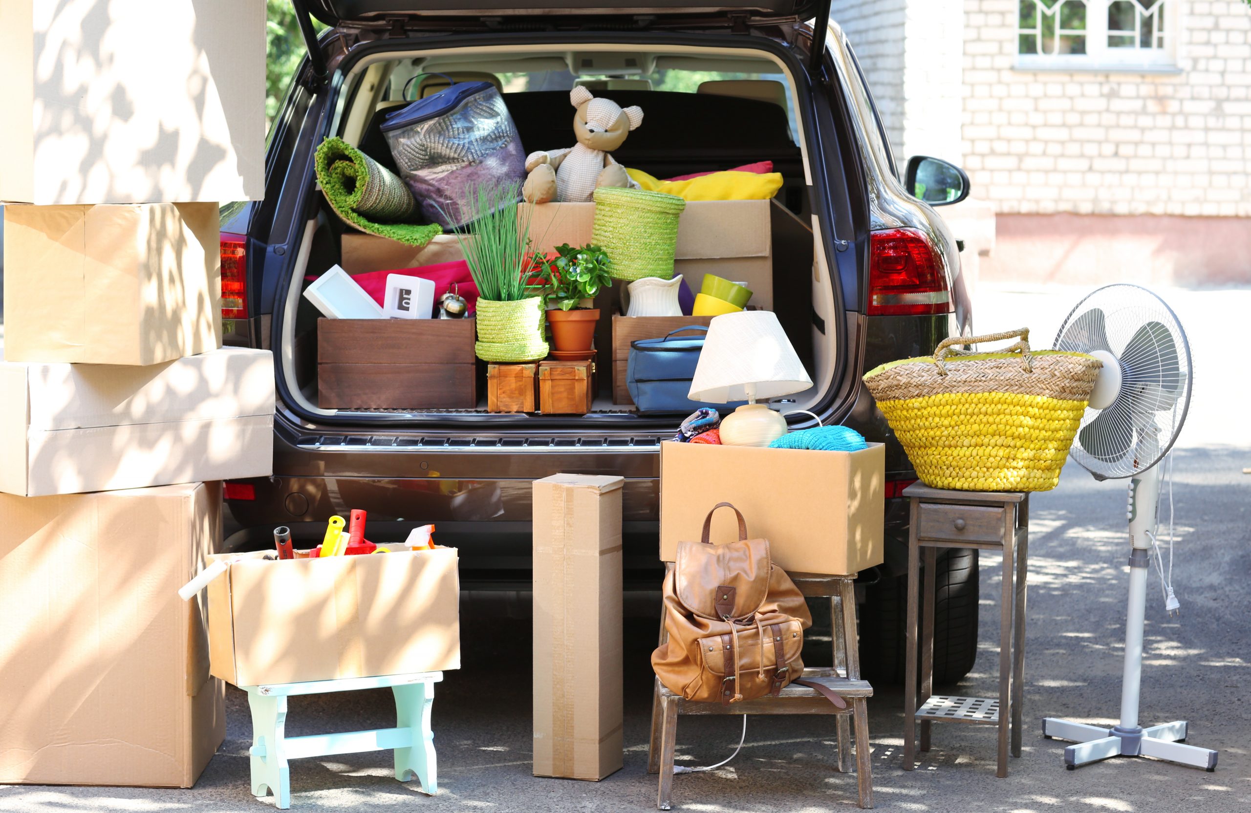 Loaded car with moving boxes and furniture ©Africa Studio