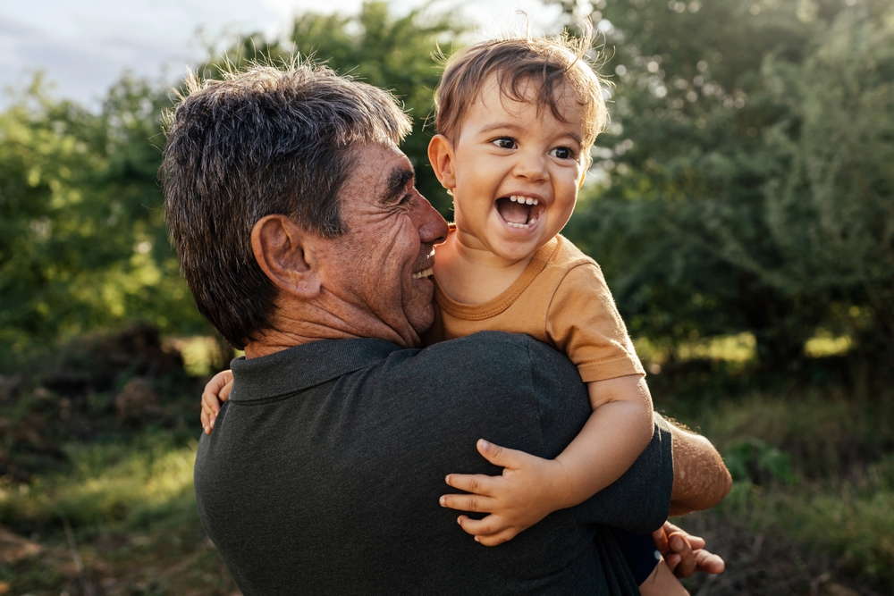 Playful grandfather spending time with his grandson in park on sunny day ©Kleber 