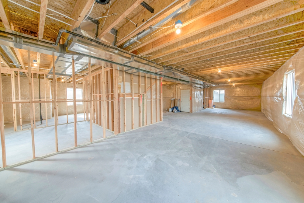 Unfinished basement interior with woodframes and windows ©Jason Finn