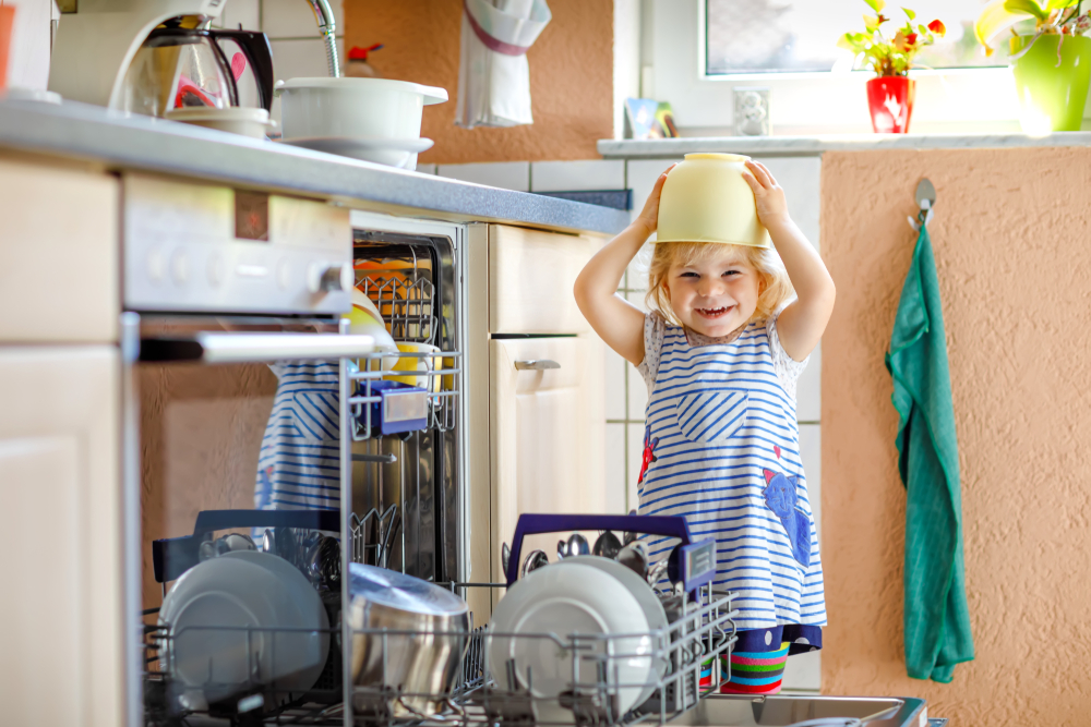 child helping to unload dishwasher©Irina Wilhauk