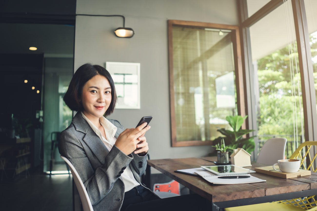 Real Estate Agent posing at their desk ©ME Image