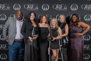 Kerley Family Homes team holding OBIE Awards trophies