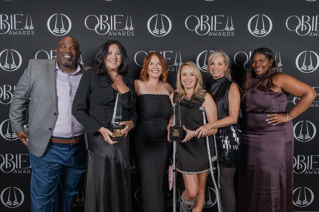 Kerley Family Homes team holding OBIE Awards trophies