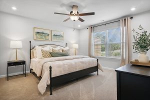 Main-level primary suite in the model home at Silver Leaf.